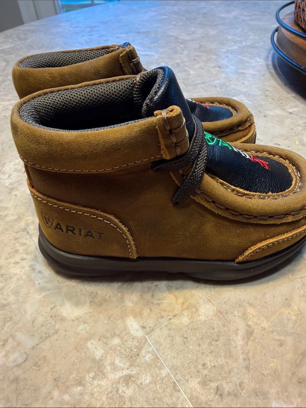 Ariat Kids Suede Moccasins in Brown with Black Inlay